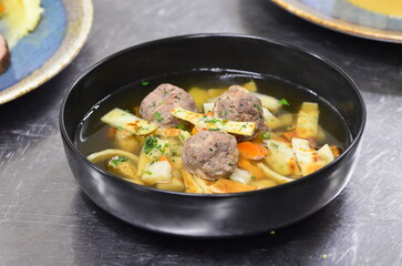 traditional Czech food served in a restaurant, beef or venison cream sauce, dumpling, cranberries