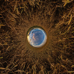 blue hole sphere or globe little planet inside sand or dry ground frame background with tractor...