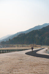 Old man walking in a cold morning