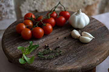 Cherry tomatoes on the marble cutting board 