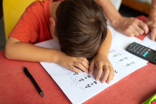 The six-year-old boy laid his head down on his homework sheet in despair.