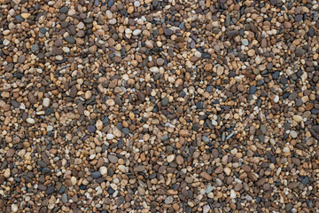 Processed collage of seashore pebbles creates a textured, natural background. Perfect for use in banners, backdrops,or 3D mapping projects,offering a rich and organic visual aesthetic for design needs