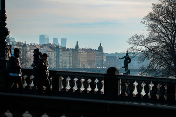 Obraz premium Morning stroll along the Vltava River in Prague with stunning views of the cityscape and historical architecture