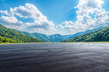 Empty asphalt road and green mountain natural landscape in sunny day