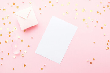 Cosmos pink background. Festive holiday greeting card for Birthday, Woman or Mothers Day, blank copy paper and a greeting card. View from above.