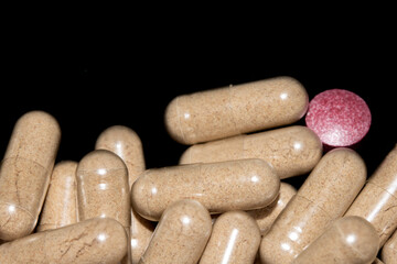 Vitamin Capsules and Pills on a White Background For Medication round and long shaped