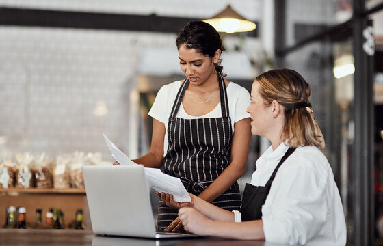 Restaurant, waitress or business owner with paperwork for planning budget, online review or admin. Laptop, manager and barista with teamwork in startup shop for report, stock taking and documents