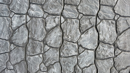 Gray abstract surface with black lines.