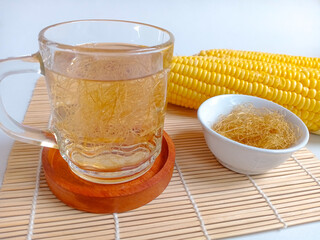 Corn hair or corn silk boiled water in a glass, has the benefit of lowering blood pressure, high cholesterol and arthritis