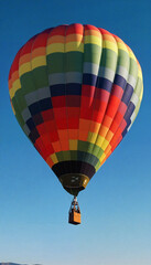 Fototapeta premium Colorful hot air balloon soaring through the sky