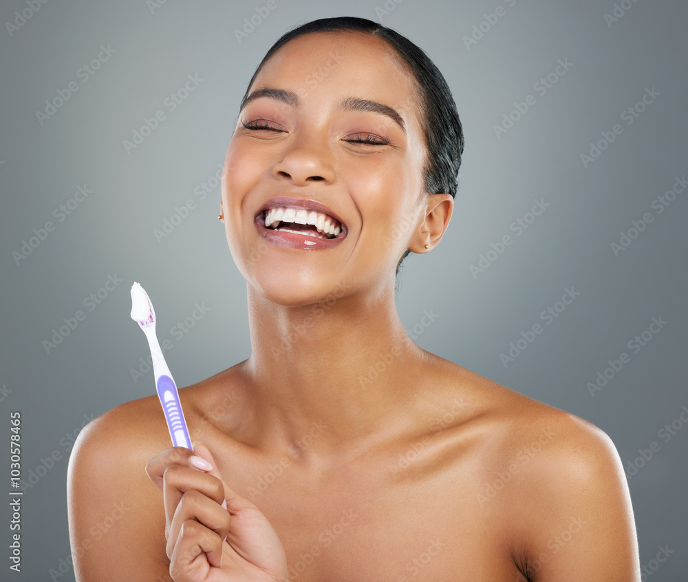 Poster Happy, toothbrush and face of woman in studio for dental hygiene, brushing teeth and cleaning. Health, laughing and person with toothpaste for oral care, wellness and grooming on gray background