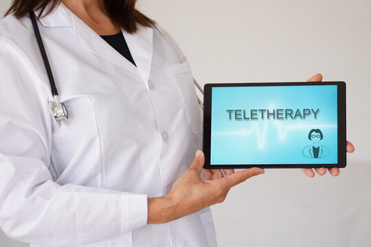 teletherapy. woman doctor with stethoscope and telehealth application on a tablet