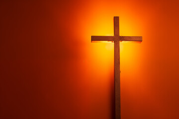 A cross by drawing on orange background at night, Halloween party decorations concept