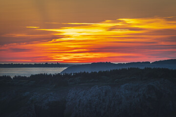 Sunset over Guernsey as viewed from the island of Sark