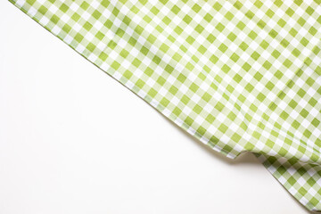 Placemat fabric cloth or arrangement of gingham-patterned fabrics in pastel green tones, isolate on...