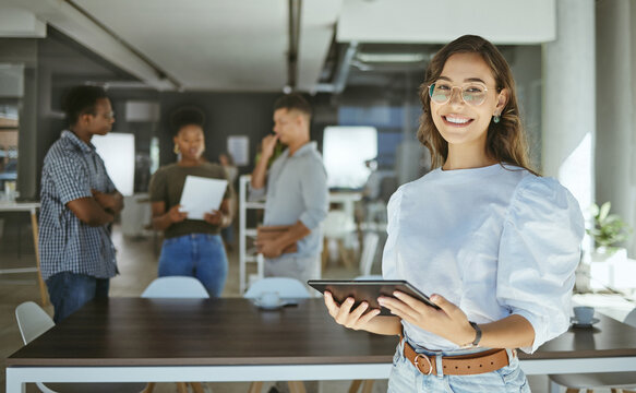 Portrait, tablet and happy business woman in startup for creative publication, online research and production. Face, smile and editor on digital technology with glasses for coworking in enterprise