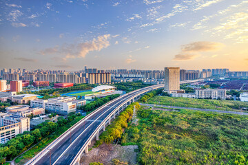 Viaduct road and cityscape in modern city at sunset