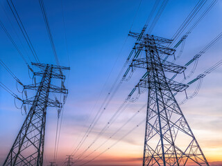 High voltage electricity tower and natural scenery at sunset