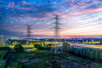 High voltage electricity tower and natural scenery at sunset