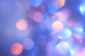 background of abstract glitter lights. blue, gold and purple. de focused
