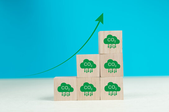 Stacking CO2 reducing icon with up arrow for decrease CO2 , carbon footprint and carbon credit to limit global warming from climate change, Bio Circular Green Economy concept..