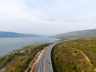 The M6  motorway Expressway Nakhon Ratchasima Province - Bang Pa-in. Lam Ta Khong River and Mountain. Drone shot of scenic landscape rural place traffic. Nakhon Ratchasima Thailand. Motorway Korat