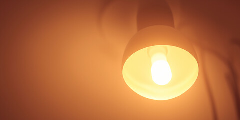 Warm toned ceiling light casting gentle illumination in modern interior setting