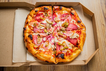 Fresh pizza in delivery box