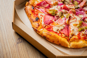 Fresh pizza in delivery box