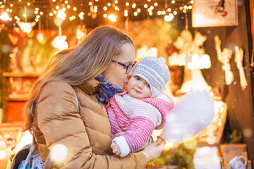 Happy mother and daughter at the traditional German Christmas market.
