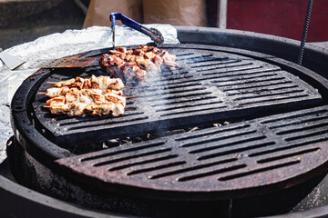Grilling Meat at a BBQ Festival: A Close-Up of Delicious Street Food.
