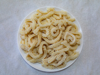 Beef tripe (bucho), beef stomach, tripe on a white plate. Dobradinha
