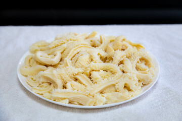 Beef tripe (bucho), beef stomach, tripe on a white plate. Dobradinha
