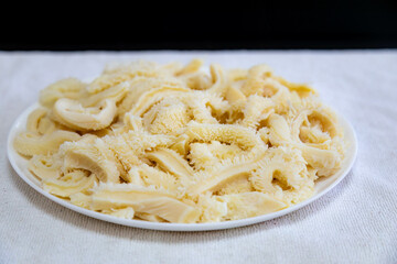 Beef tripe (bucho), beef stomach, tripe on a white plate. Dobradinha