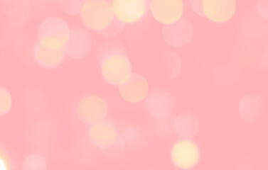 Defocused bokeh background in pastel colors with copy space. Defocused abstract background with pink and yellow circles on light pink background.