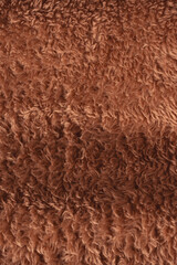 Texture of a brown faux fur as a background.