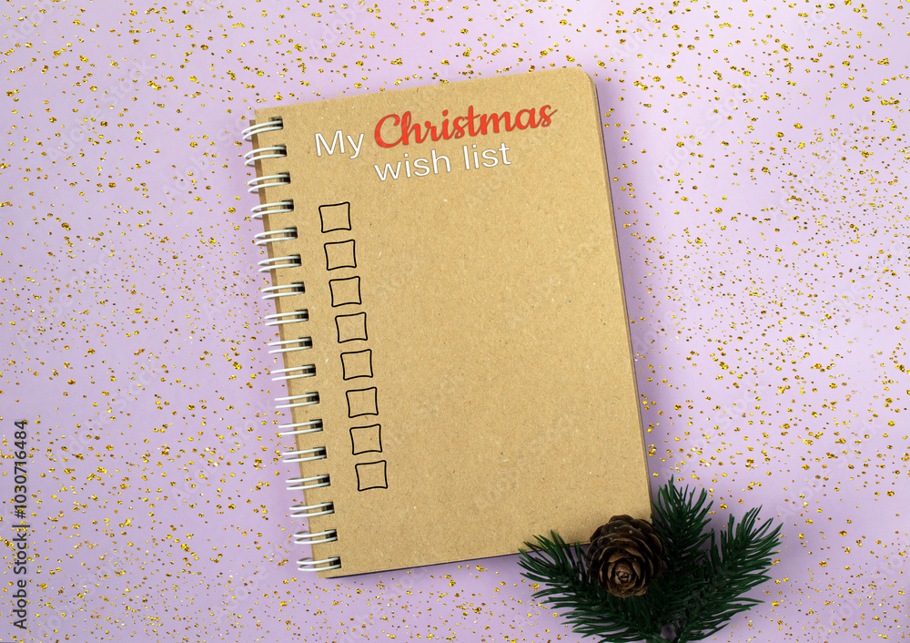 Poster spiral bound notebook with a christmas wish list written on it