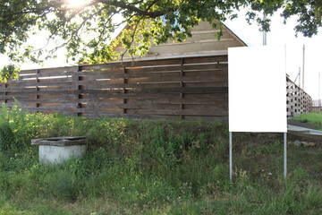 mock up stand signboard in the countryside dacha village near the wooden house