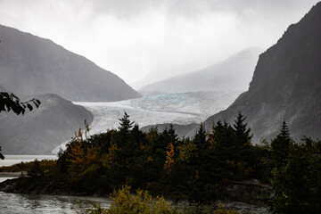 Mid-range view of a Glacier cascading down the mountains, with a clear view of texture of glacier element.