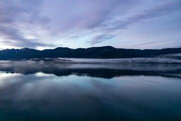 Lilac Skies Cloudscape in Alaska during the fall, cascading over still waters - the calm before the storm.