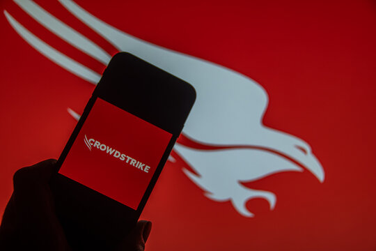 Rheinbach, Germany  13 October 2024,  The brand logo of the US company "CrowdStrike" on the display of a smartphone (focus on the brand logo)
