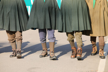 four characters with ancient military cloaks wearing clothes from the First World War during the...