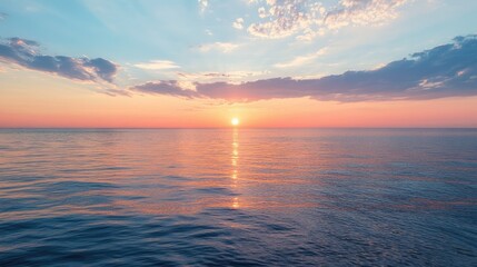Fototapeta premium Quiet sunset over the calm waters of Lake Michigan, with room for copy in the sky