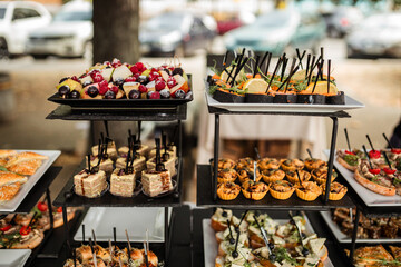 Festive buffet. Table with desserts in glass and snacks. Catering. Buffet. Self-service. Hotel and restaurant services. Wedding buffet