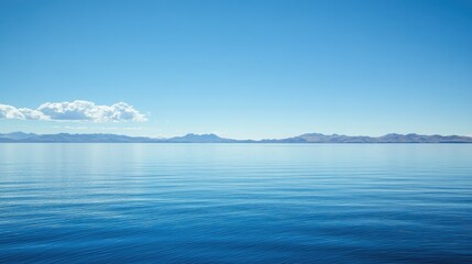 Fototapeta premium The serene blue waters of Lake Titicaca with a clear sky for text or design