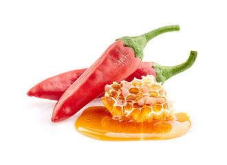 Honey with chilli peppers in closeup