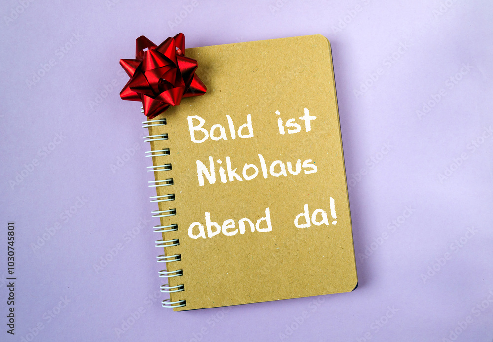 Aufkleber notebook with a red bow on it