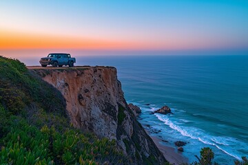 A truck parked on a cliffside with a panoramic view of the ocean below, soft waves crashing against the shore, and the horizon stretching endlessly
