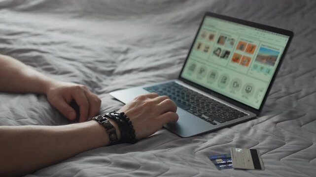 Man Using Laptop At Home For Online Shopping In Cyber Monday Sale. Hands Only