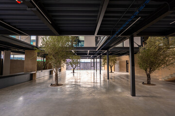 modern loft office interior with furniture, 3D, render. 
Corporate business people working in busy marketing office space, planning strategy in books and reading email on laptop at work.